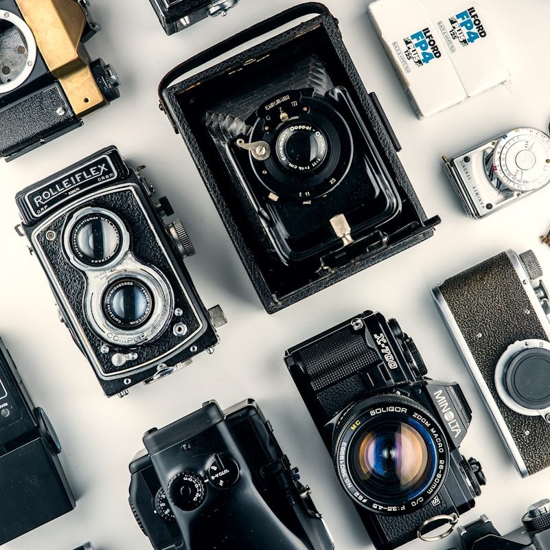 black cameras on white surface